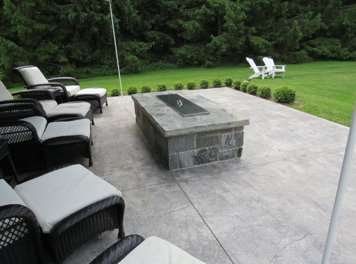 Stone fire pit in Elite Blue Granite with a granite cap