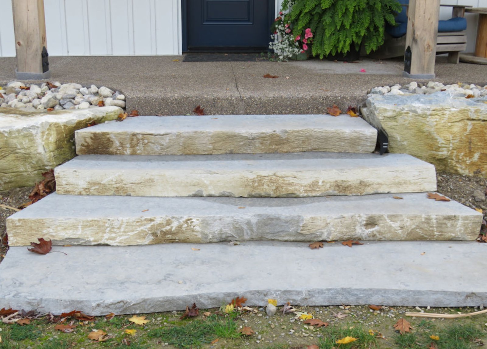 Weatheredge Limestone natural stone steps with rock-face edge installed as front entry