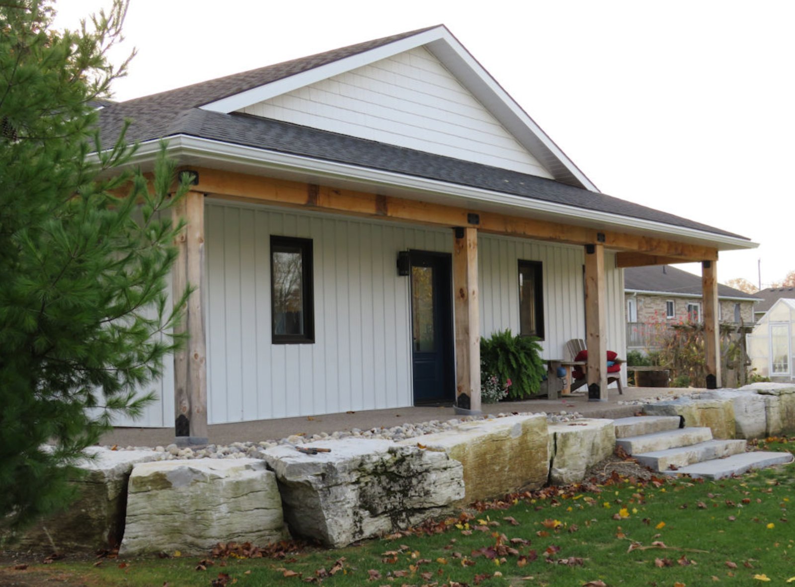Weatheredge Limestone steps with armor stone landscaping at farmhouse porch
