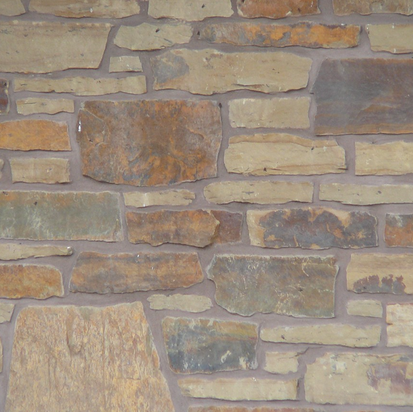 Peterbourough Fence Wall with Eden Mills Rustic Ranch - Earth Tone Blend Thin Stone Veneer - Flats