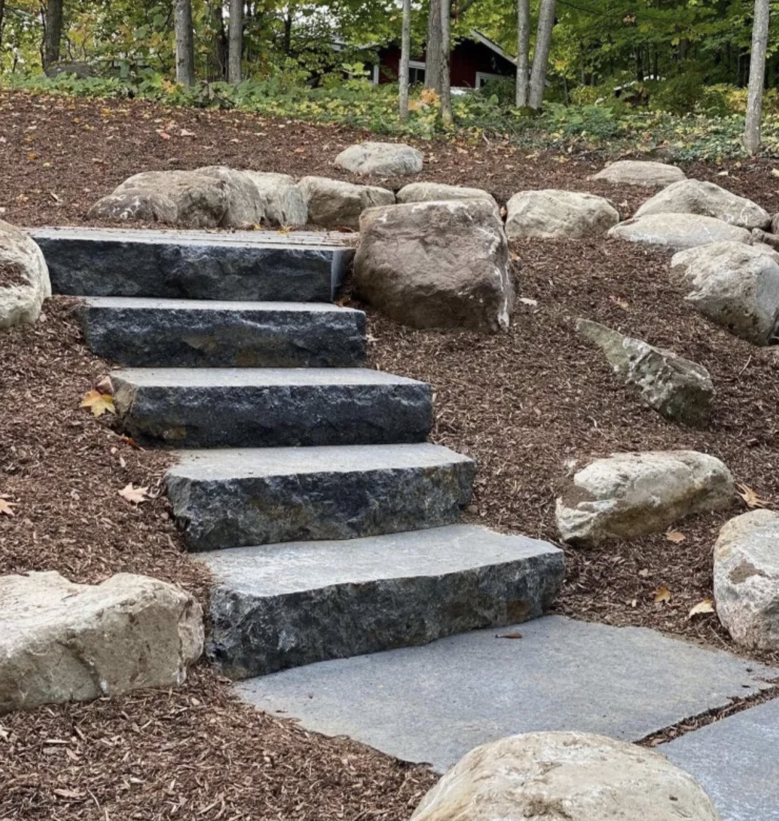 Sturgeon River Black Granite natural stone steps in landscaped cottage path with boulders
