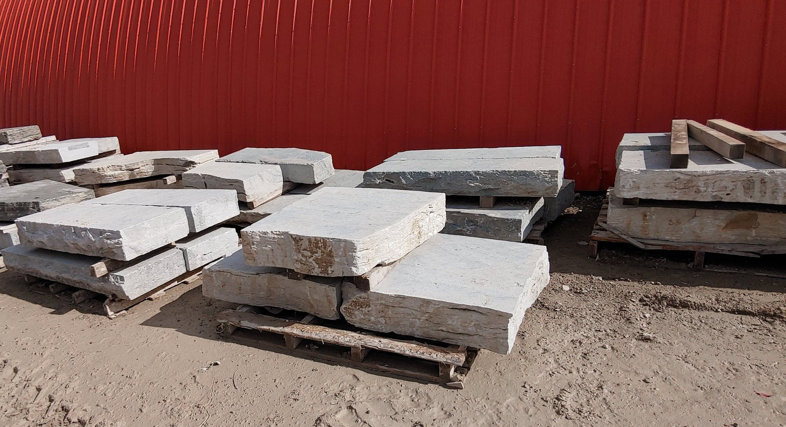 Weatheredge Limestone step slabs stacked on pallets in stone yard