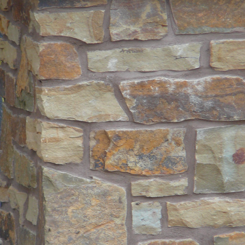 Peterbourough Fence Wall with Eden Mills Rustic Ranch - Earth Tone Blend Thin Stone Veneer - Flats