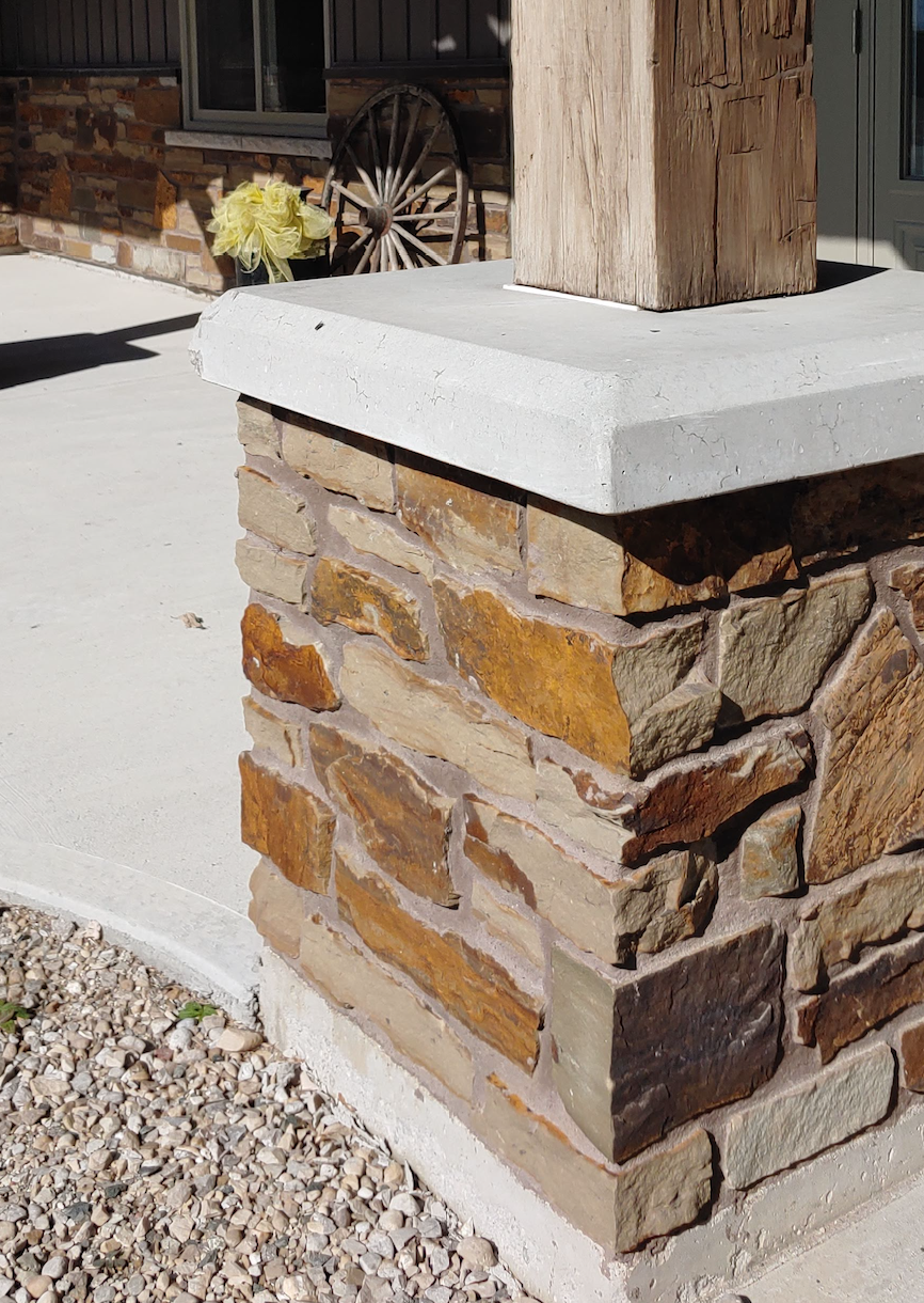 Peterbourough Fence Wall with Eden Mills Rustic Ranch - Earth Tone Blend Thin Stone Veneer - Flats