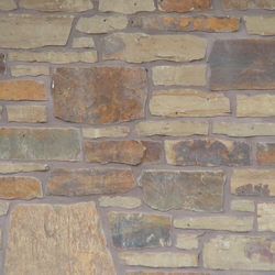 Peterbourough Fence Wall with Eden Mills Rustic Ranch - Earth Tone Blend Thin Stone Veneer - Flats